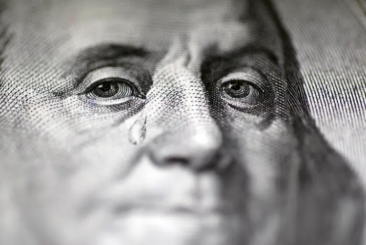 Dólar: moeda futura de maior liquidez perdia 0,27% neste pregão, a 4,053 reais (burakpekakcan/Getty Images)