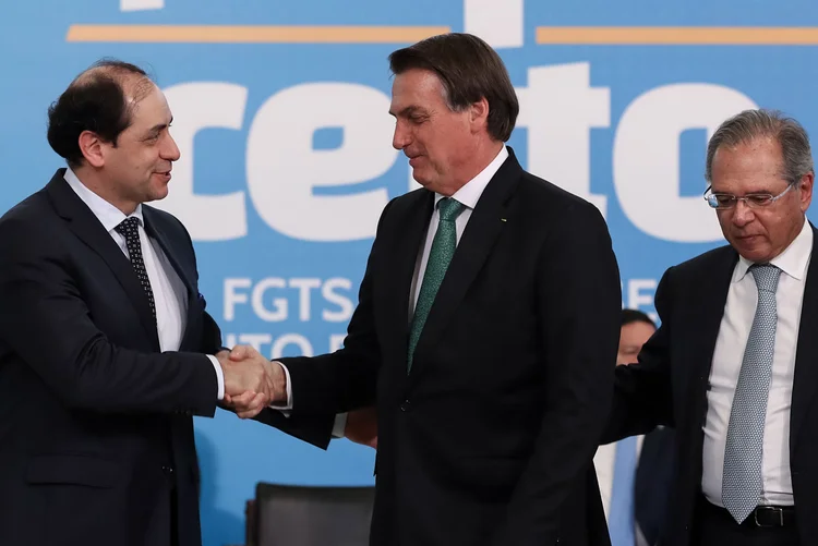 Secretário da Fazenda, Waldery Junior, com presidente Bolsonaro e ministro Paulo Guedes: "Continuamos com viés de descontingenciamento", disse secretário (Marcos Corrêa/PR/Reprodução)