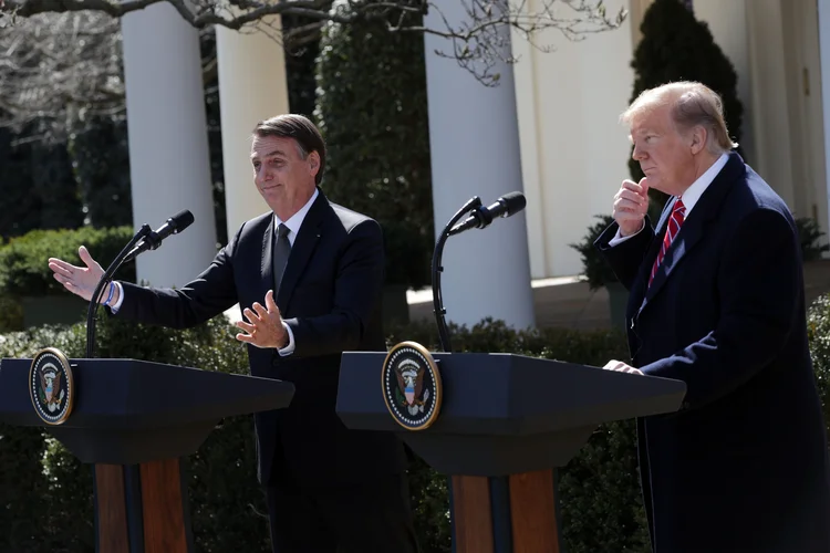 Bolsonaro e Trump (arquivo): presidentes fazem entrevista coletiva em Washington, em março de 2019. (Alex Wong/Getty Images)