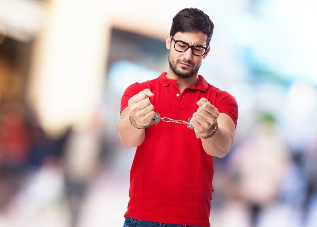 chinese man with handcuffs (Designed by Asierromero / Freepik/Creative Commons)