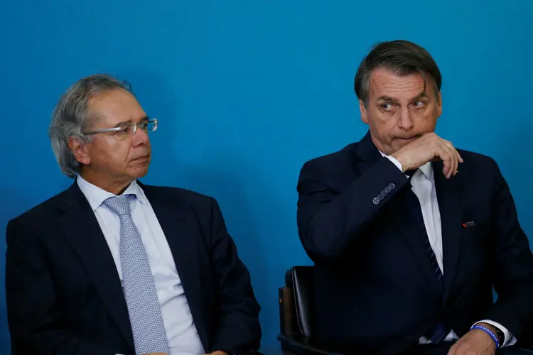 Paulo Guedes e Jair Bolsonaro: o acordo devolveria ao Executivo o controle sobre R$ 11 bilhões das chamadas despesas discricionárias (Adriano Machado/Reuters)