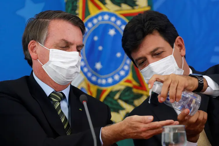 Jair Bolsonaro e ex-ministro Mandetta: (Adriano Machado/Reuters)