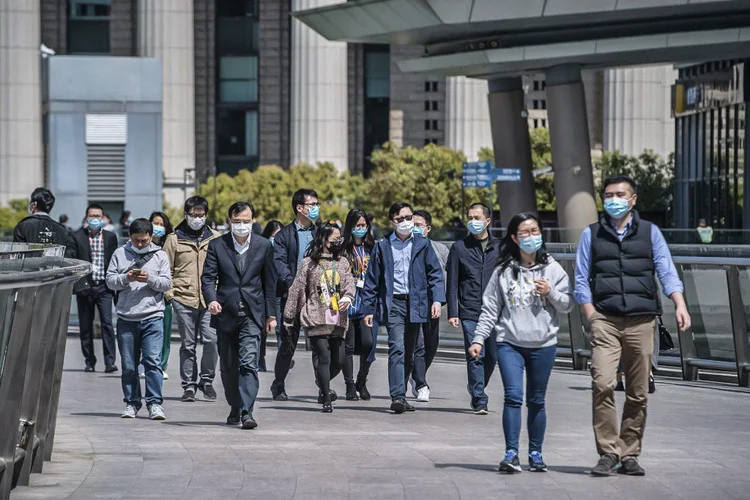 China: local que foi epicentro do surto do novo coronavírus não apresentou novos casos pela primeira vez desde o início da doença (Bloomberg/Getty Images)