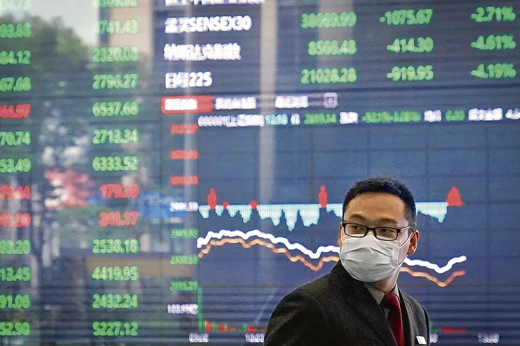 Mercado de ações: tensão nas bolsas de valores por causa da pandemia continua (Aly Song/Reuters)