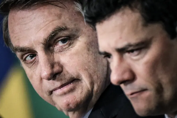 Jair Bolsonaro e Sergio Moro: presidente, que criticou o relator do caso, já pediu publicamente o arquivamento do inquérito (Adriano Machado/Reuters)