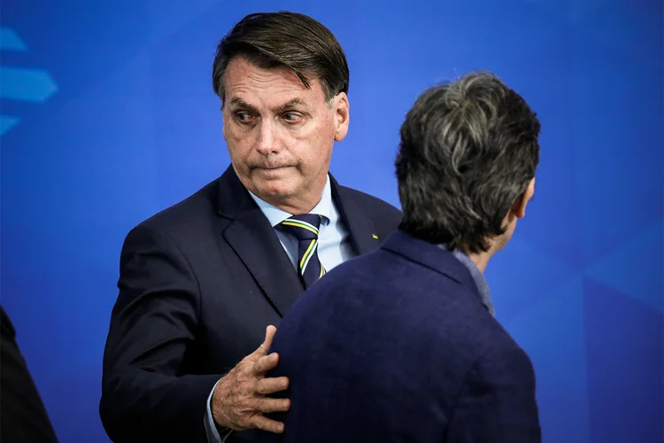 Bolsonaro e Teich: ministro pediu exoneração após desentendimentos com o presidente (Adriano Machado/Reuters)