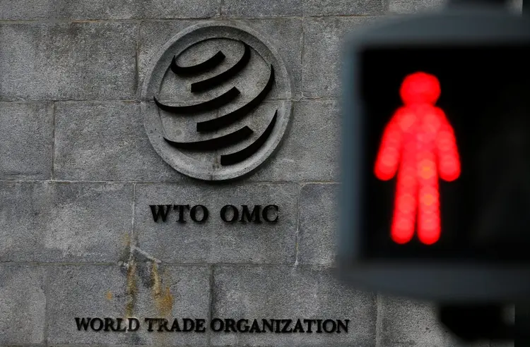 enfim, entendimento: celebração do acordo antecede a abertura da 13ª Conferência Ministerial da OMC (Denis Balibouse/Reuters)