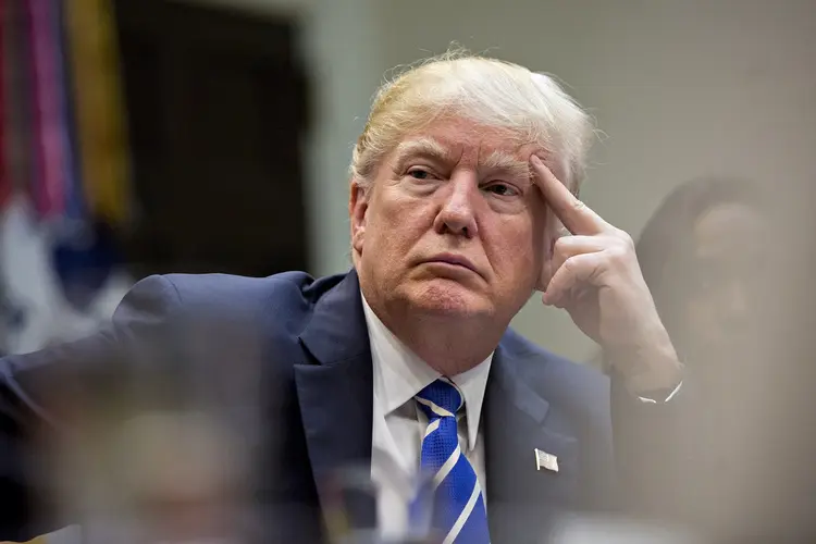 WASHINGTON, DC - MARCH 27:  U.S. President Donald Trump listens while meeting with women small business owners in the Roosevelt Room of the White House on March 27, 2017 in Washington, D.C.  Investors on Monday further unwound trades initiated in November resting on the idea that the election of Trump and a Republican Congress meant smooth passage of an agenda that featured business-friendly tax cuts and regulatory changes. (Photo by  Andrew Harrer-Pool/Getty Images) (Andrew Harrer-Pool/Getty Images)