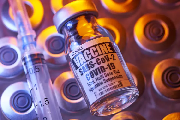 Covid-19 vaccine - Medical injection vials:  syringe with close-up and colorful (Bill Oxford/Getty Images)