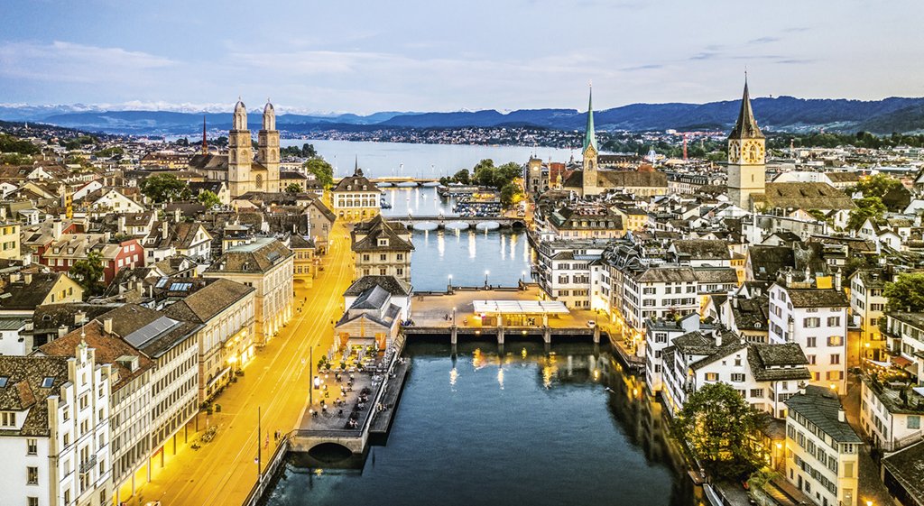 Twilight over Zurich old town along the Limmat river  in Switzerland largest city