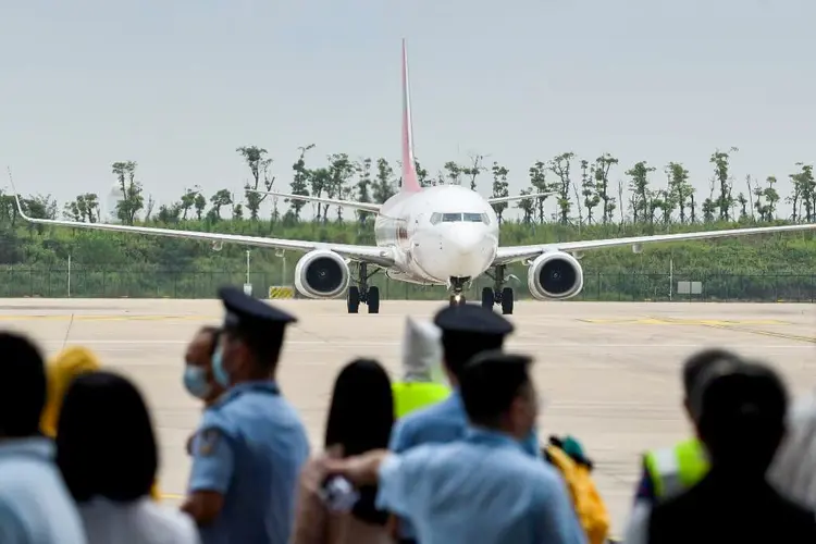 Wuhan, epicentro da covid-19, recebe 1º voo internacional desde janeiro (STR/AFP)