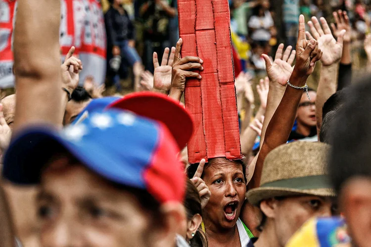 Venezuelanos: eles deixaram um país dividido por outro país que está tão dividido quanto (Carlos Garcia Rawlins/Reuters)