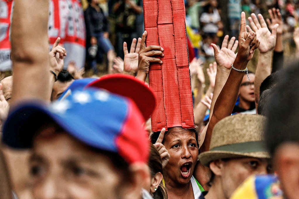 Venezuelanos: eles deixaram um país dividido por outro país que está tão dividido quanto (Reuters/Carlos Garcia Rawlins)