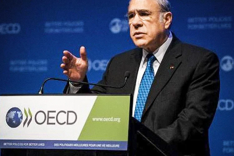 O secretário geral da Organização para Cooperação e Desenvolvimento Econômico (OCDE) é visto durante conferência da organização em Paris (Eric Piermont/AFP/AFP)