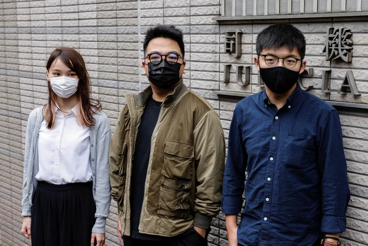 Agnes Chow, a "Mulan de Hong Kong", Ivan Lam e Joshua Wong: condenados por fazerem assembleia (Tyrone Siu/Reuters)