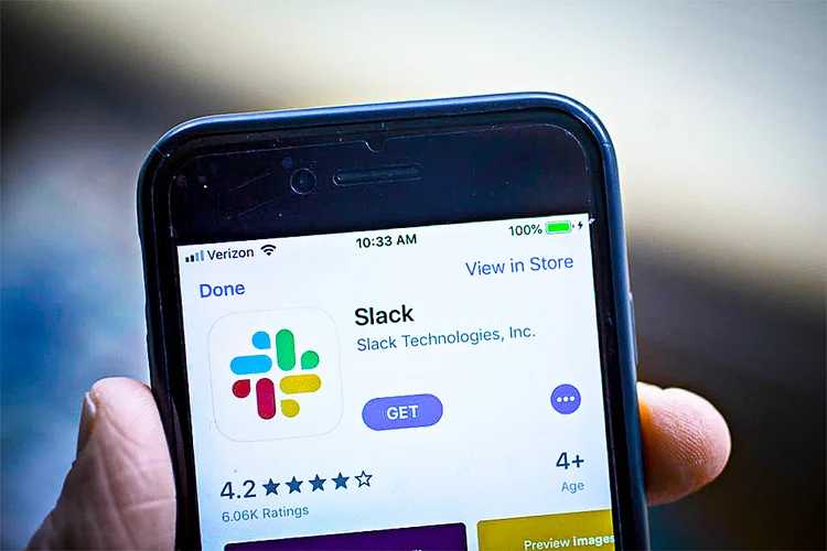 The Slack Technologies Inc. application is displayed in the App Store on an Apple Inc. iPhone in an arranged photograph taken in Arlington, Virginia, U.S. on Monday, April 29, 2019. Slack's filing last week confirms its plans to avoid a traditional public offering and instead list its shares directly on the New York Stock Exchange under the symbol SK. Photographer: Andrew Harrer/Bloomberg via Getty Images (Bloomberg/Getty Images)