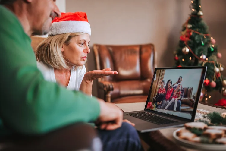 happy family enjoying festive Christmas food, they are together, give each other presents and have fun (Royalty-free/Getty Images)