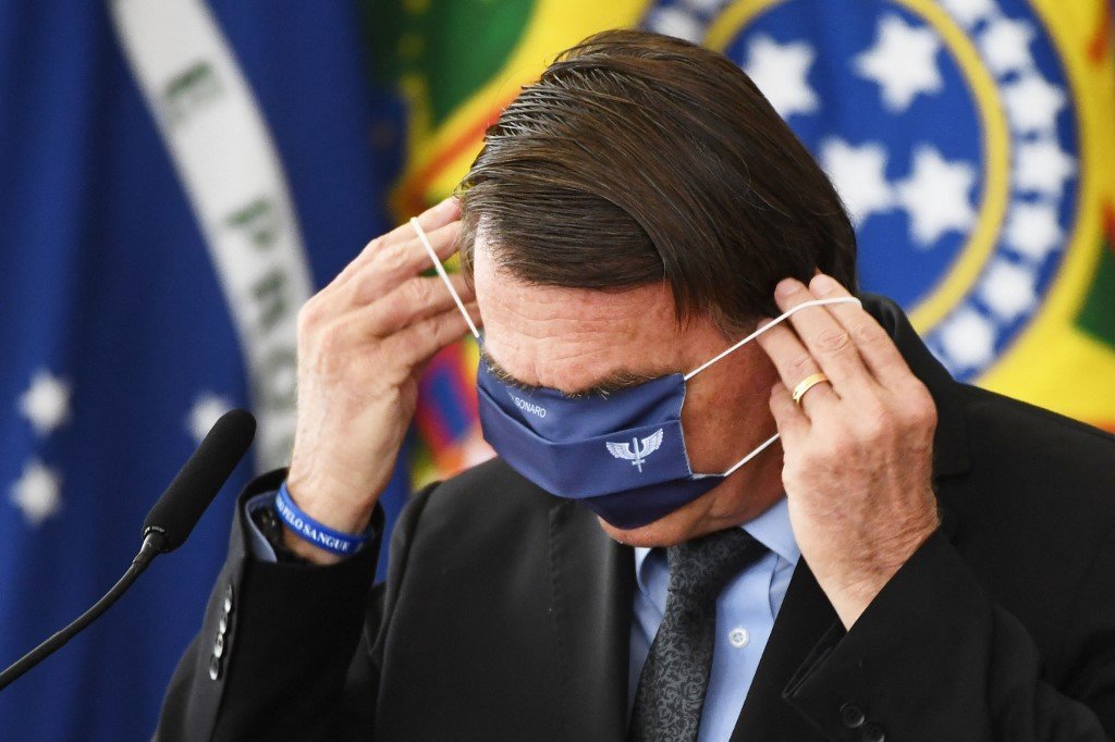 Bolsonaro encontra-se nesta quarta com líderes do Congresso e governadores para debater a crise (AFP/EVARISTO SA / AFP)