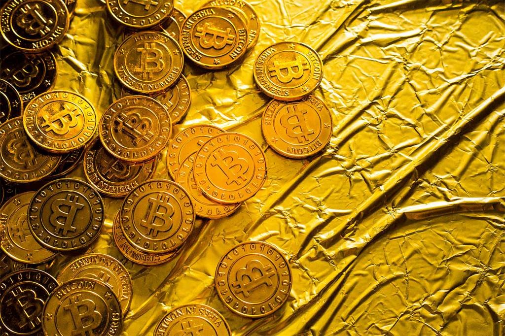 Wall Street retoma debate sobre relação do ouro com criptomoedas
