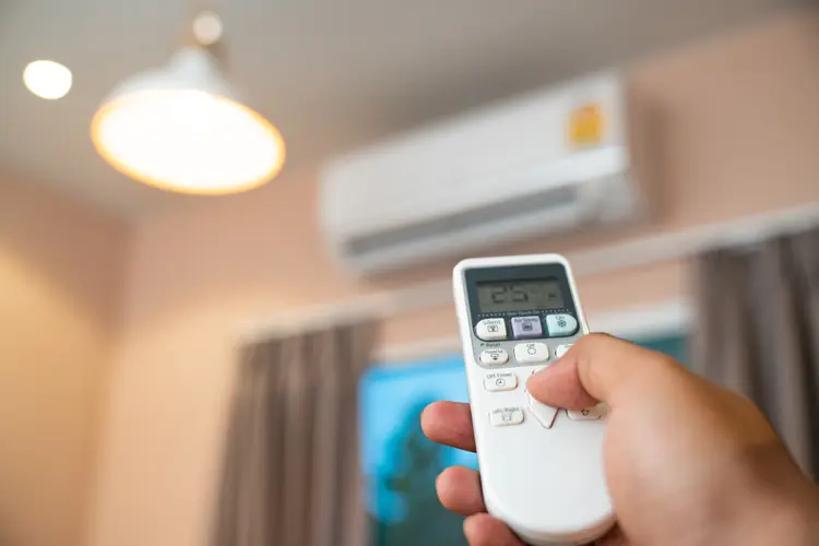 Air conditioner with remote controller (Witthaya Prasongsin/Getty Images)
