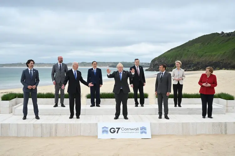 CARBIS BAY, CORNWALL - JUNE 11: (L-R) Canadian Prime Minister Justin Trudeau, President of the European Council Charles Michel, US President Joe Biden, Japanese Prime Minister Yoshihide Suga, British Prime Minister Boris Johnson, Italian Prime Minister Mario Draghi, French President Emmanuel Macron, President of the European Commission Ursula von der Leyen and German Chancellor Angela Merkel, pose for the Leaders official welcome and family photo during the G7 Summit In Carbis Bay, on June 11, 2021 in Carbis Bay, Cornwall. UK Prime Minister, Boris Johnson, hosts leaders from the USA, Japan, Germany, France, Italy and Canada at the G7 Summit. This year the UK has invited India, South Africa, and South Korea to attend the Leaders' Summit as guest countries as well as the EU. (Photo by Leon Neal - WPA Pool/Getty Images) (Photo by Leon Neal - WPA Pool/Getty Images)