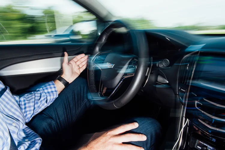 A Magna International Inc. representative leads a demonstration of a semi-autonomous vehicle in Holly, Michigan, U.S. Photographer: Graham Walzer/Bloomberg (Graham Walzer/Bloomberg)