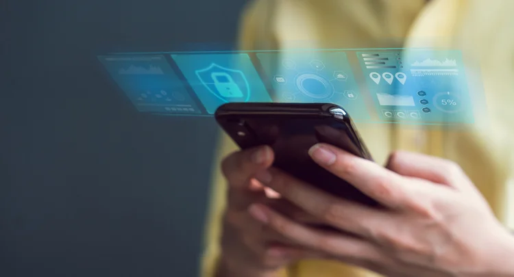 Technology concept with cyber security internet and networking, woman hand using smartphone, screen padlock icon on digital display. (Sitthiphong/Getty Images)