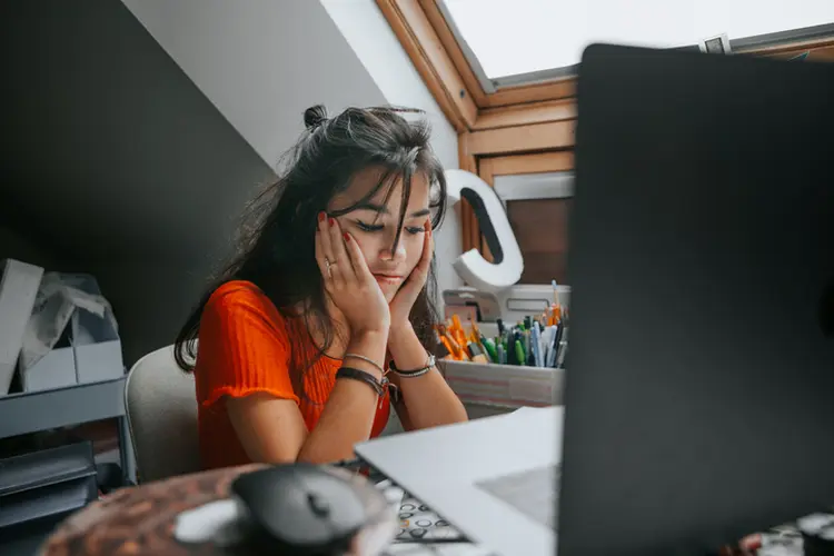 female teenager feeling stressed studing at home.E learning.Home schooling (Carol Yepes/Getty Images)