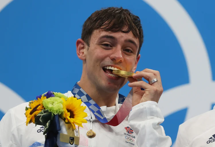 TOKYO, JAPAN - JULY 26: Tom Daley of Team Great Britain poses with the gold medal during the medal presentation for the Men's Synchronised 10m Platform Final on day three of the Tokyo 2020 Olympic Games at Tokyo Aquatics Centre on July 26, 2021 in Tokyo, Japan. (Photo by Clive Rose/Getty Images) (Clive Rose/Getty Images)