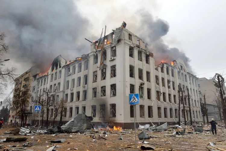 Firefighters work to contain a fire at the Economy Department building of Karazin Kharkiv National University, allegedly hit during recent shelling by Russia, on March 2, 2022. (Photo by Sergey BOBOK / AFP) (Photo by SERGEY BOBOK/AFP via Getty Images) (SERGEY BOBOK/AFP/Getty Images)