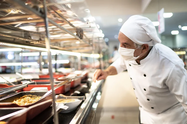 Chef checking food on the buffet (FG Trade/Getty Images)