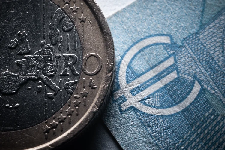 22 June 2022, Baden-Wuerttemberg, Rottweil: The lettering Euro can be seen on a 1-Euro coin next to a 20-Euro Schin in an office. Photo: Silas Stein/dpa (Photo by Silas Stein/picture alliance via Getty Images) (Silas Stein/picture alliance/Getty Images)