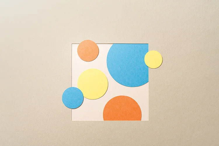 Paper Craft Multi-colored Scatter Plot Chart on Beige Background Directly above View. (MirageC/Getty Images)