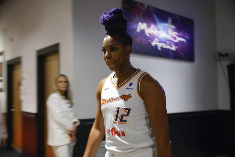 Reshanda Gray, Brittney Griner's teammate on the Phoenix Mercury women's basketball team, leaves the court after a game against the Connecticut Sun at Mohegan Sun Arena in Uncasville, Connecticut on August 4, 2022. - Phoenix Mercury and Connecticut Sun players observed 42 seconds of silence before their game on Thursday in solidarity with WNBA star Brittney Griner after she was sentenced to nine years in prison in Russia.
The number honored Griner's jersey number 42 and the gesture brought tears to the eyes of players from both teams and from fans at Mohegan Sun Arena, where the moment ended with chants of "Bring her home!"
Griner was convicted and sentenced in a Russian court earlier Thursday on charges of smuggling cannabis vape cartridges into the country. (Photo by KENA BETANCUR / AFP) (Photo by KENA BETANCUR/AFP via Getty Images) (AFP/Getty Images)