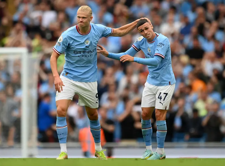 MANCHESTER, ENGLAND - AUGUST 27:  Erling Haaland of Manchester City celebrates their sides second goal with team mate Phil Foden during the Premier League match between Manchester City and Crystal Palace at Etihad Stadium on August 27, 2022 in Manchester, England. (Photo by Shaun Botterill/Getty Images) (Shaun Botterill/Getty Images)
