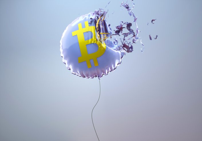 Digital generated image of purple circular helium balloon with bitcoin sign on it exploding against grey background visualising stock market crash. (Getty/Getty Images)