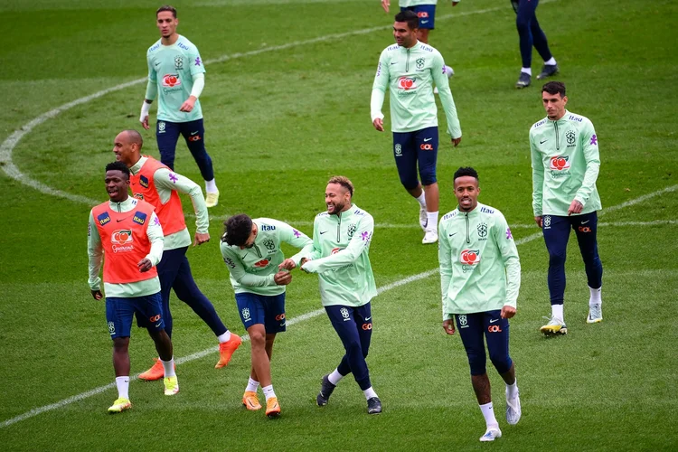 Brazil's forward Neymar (C) shares a laugh with teammates during a training session at Charlety Stadium in Paris on September 26, 2022, on the eve of the international friendly football match between Brazil and Tunisia. (Photo by Anne-Christine POUJOULAT / AFP) (Photo by ANNE-CHRISTINE POUJOULAT/AFP via Getty Images) (ANNE-CHRISTINE POUJOULAT/AFP/Getty Images)