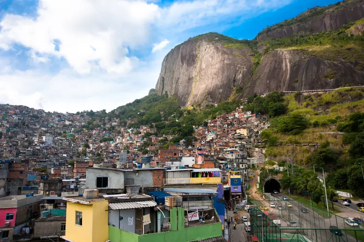 Rio de Janeiro, RJ, Brazil - September 2nd, 2012: A view of the Rocinha, the largest favela in Brazil, located in Rio de Janeiro's South Zone between the districts of São Conrado and Gávea. Although Rocinha is officially classified as a neighborhood, many still refer to it as a favela. It developed from a shanty town into an urbanized slum. (Eduardo Fonseca Arraes/Getty Images)