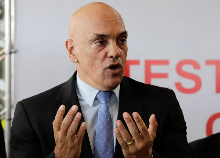 Brazil's Supreme Federal Court (STF) Minister and president of the Superior Electoral Court, Alexandre de Moraes, smiles at a polling station during the legislative and presidential election, in Sao Paulo, Brazil, on October 2, 2022. - Voting began early Sunday in South America's biggest economy, plagued by gaping inequalities and violence, where voters ar expected to choose between far-right incumbent Jair Bolsonaro and leftist front-runner Luiz Inacio Lula da Silva, any of which must garner 50 percent of valid votes, plus one, to win in the first round. (Photo by Sergio Lima / AFP) (Photo by SERGIO LIMA/AFP via Getty Images) (SERGIO LIMA/Getty Images)