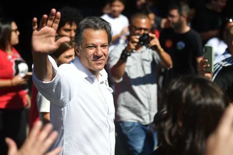 Sao Paulo's state governor candidate for the Workers' Party (PT) Fernando Haddad waves on arrival at a polling station during the presidential run-off election in Sao Paulo, Brazil, on October 30, 2022. - After a bitterly divisive campaign and inconclusive first-round vote, Brazil elects its next president in a cliffhanger runoff between far-right incumbent Jair Bolsonaro and veteran leftist Luiz Inacio Lula da Silva. (Photo by CARL DE SOUZA / AFP) (Photo by CARL DE SOUZA/AFP via Getty Images) (CARL DE SOUZA/Getty Images)