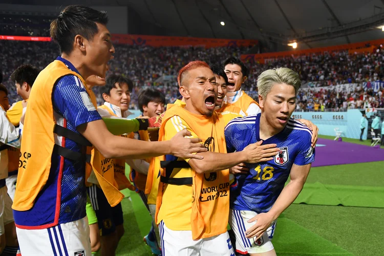 DOHA, QATAR - NOVEMBER 23: Takuma Asano of Japan celebrates scoring their second goal with their teammates during the FIFA World Cup Qatar 2022 Group E match between Germany and Japan at Khalifa International Stadium on November 23, 2022 in Doha, Qatar. (Photo by David Ramos - FIFA/FIFA via Getty Images) (David Ramos - FIFA/FIFA/Getty Images)