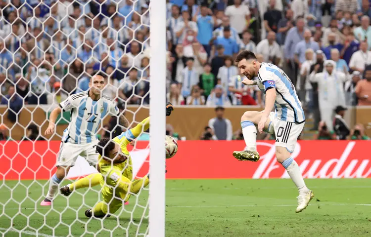 LUSAIL CITY, QATAR - DECEMBER 18: Lionel Messi of Argentina scores the team's third goal past Hugo Lloris of France during the FIFA World Cup Qatar 2022 Final match between Argentina and France at Lusail Stadium on December 18, 2022 in Lusail City, Qatar. (Photo by Julian Finney/Getty Images) (Julian Finney/Getty Images)