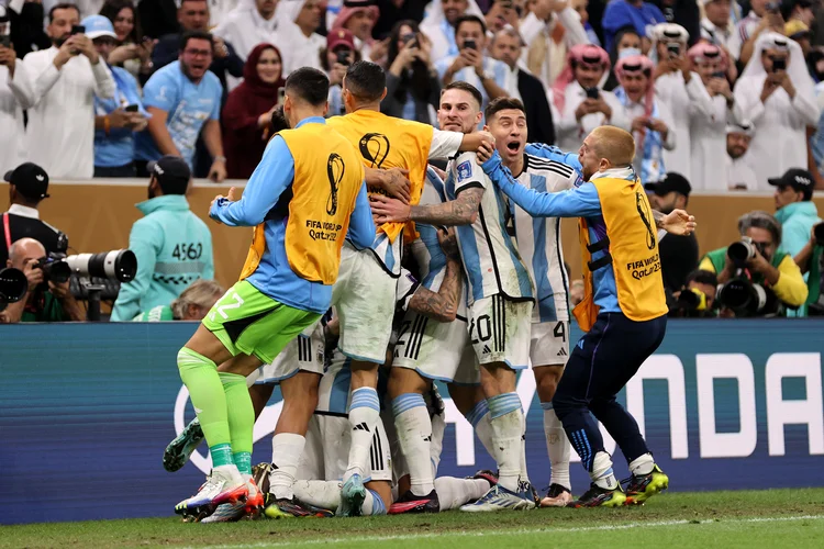 LUSAIL CITY, QATAR - DECEMBER 18: Lionel Messi of Argentina celebrates with teammates after scoring the team's third goal during the FIFA World Cup Qatar 2022 Final match between Argentina and France at Lusail Stadium on December 18, 2022 in Lusail City, Qatar. (Photo by Clive Brunskill/Getty Images) (Clive Brunskill/Getty Images)