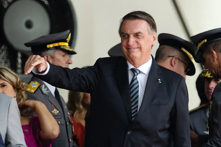 Brazilian President Jair Bolsonaro gestures during a graduation ceremony for cadets at the Agulhas Negras Military Academy in Resende, Rio de Janeiro State, Brazil, on November 26, 2022. - Bolsonaro has returned to a public event after more than three weeks without a public appearance following his election defeat by Luiz Inacio Lula da Silva. (Photo by TÉRCIO TEIXEIRA / AFP) (Photo by TERCIO TEIXEIRA/AFP via Getty Images) (TERCIO TEIXEIRA/Getty Images)