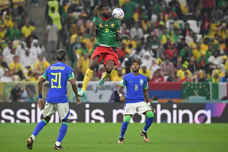 TOPSHOT - Cameroon's midfielder #08 Andre-Frank Zambo Anguissa (C) heads the ball during the Qatar 2022 World Cup Group G football match between Cameroon and Brazil at the Lusail Stadium in Lusail, north of Doha on December 2, 2022. (Photo by NELSON ALMEIDA / AFP) (Photo by NELSON ALMEIDA/AFP via Getty Images) (NELSON ALMEIDA/AFP/Getty Images)