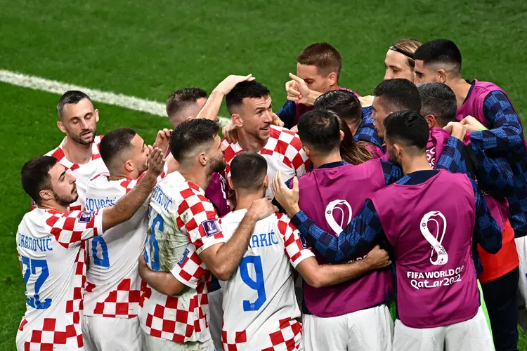 Croatia's players celebrate after their team scored first goal during the Qatar 2022 World Cup round of 16 football match between Japan and Croatia at the Al-Janoub Stadium in Al-Wakrah, south of Doha on December 5, 2022. (Photo by Anne-Christine POUJOULAT / AFP) (Photo by ANNE-CHRISTINE POUJOULAT/AFP via Getty Images) (ANNE-CHRISTINE POUJOULAT/AFP/Getty Images)
