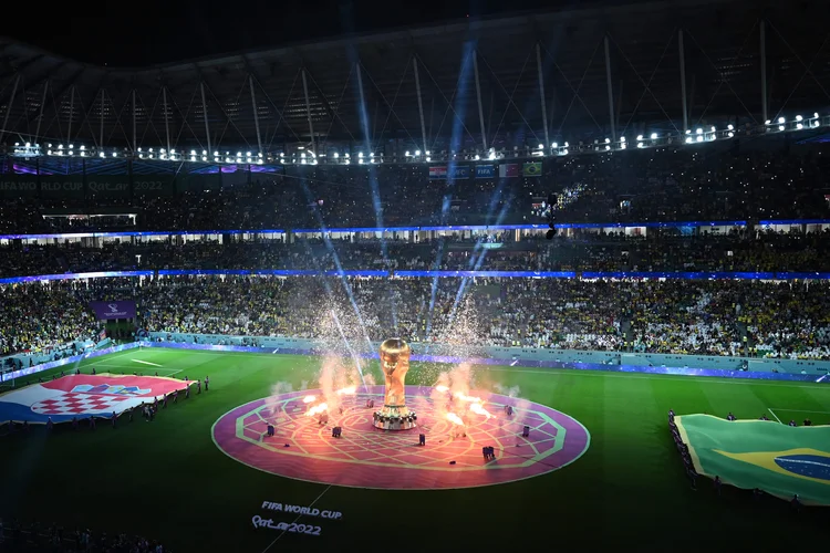 Fireworks go off around a replica of the World Cup trophy before the start of the Qatar 2022 World Cup quarter-final football match between Croatia and Brazil at Education City Stadium in Al-Rayyan, west of Doha, on December 9, 2022. (Photo by INA FASSBENDER / AFP) (Photo by INA FASSBENDER/AFP via Getty Images) (NA FASSBENDER/AFP/Getty Images)