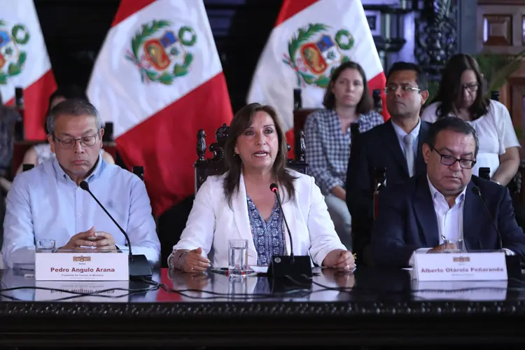 Peruvian President Dina Boluarte (C) speaks during a conference at the Government Palace in Lima, on December 17, 2022. - Boluarte said on Saturday she would remain in office and asked Congress to bring forward general elections to end the crisis and protests sparked by the impeachment of her predecessor, Pedro Castillo. (Photo by Lucas AGUAYO / AFP) (Photo by LUCAS AGUAYO/AFP via Getty Images) (Lucas Aguayo/Getty Images)