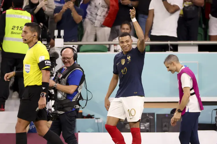 DOHA, QATAR - DECEMBER 4: Kylian Mbappe of France celebrates his second goal during the FIFA World Cup Qatar 2022 Round of 16 match between France and Poland at Al Thumama Stadium on December 4, 2022 in Doha, Qatar. (Photo by Jean Catuffe/Getty Images) (Jean Catuffe/Getty Images)