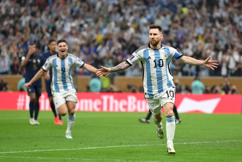 LUSAIL CITY, QATAR - DECEMBER 18: Lionel Messi of Argentina celebrates after scoring the team's first goal during the FIFA World Cup Qatar 2022 Final match between Argentina and France at Lusail Stadium on December 18, 2022 in Lusail City, Qatar. (Photo by Dan Mullan/Getty Images) (Dan Mullan/Getty Images)